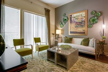 Wood-style flooring in living and dining areas, plush carpeting in bedrooms